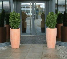 Tall tapered curved round ceramic style GRP planter